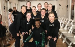 Hannah Lederman and her fellow Nolte Academy dancers sport their Humanize My Hoodie “ally” sweatshirts and pose with a runway model on Sept. 14 at New York Fashion Week. 