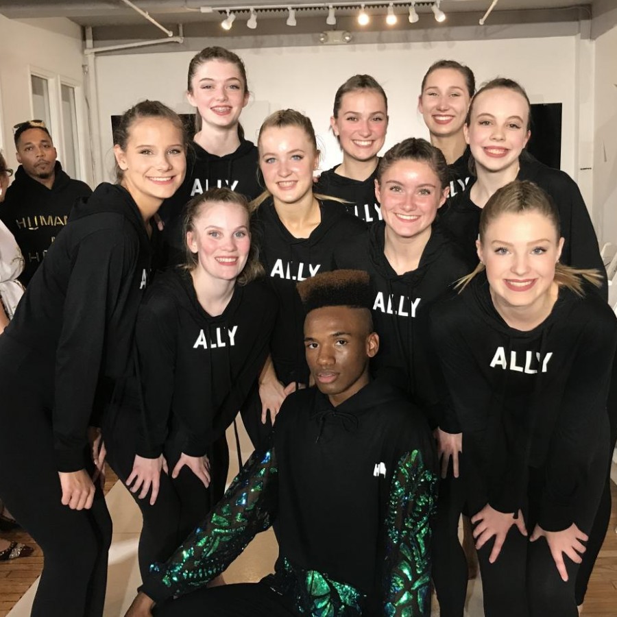 Hannah Lederman and her fellow Nolte Academy dancers sport their Humanize My Hoodie “ally” sweatshirts and pose with a runway model on Sept. 14 at New York Fashion Week. 