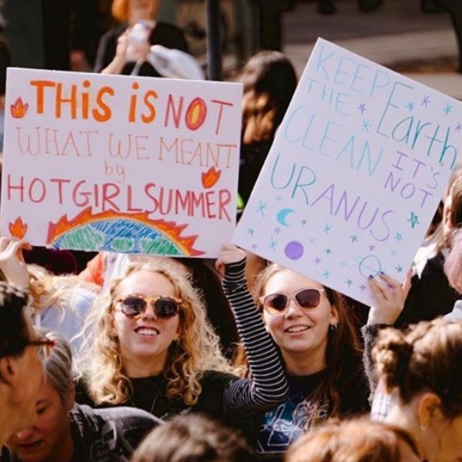 Students take a stand for environmental action at the climate strike in Iowa City.