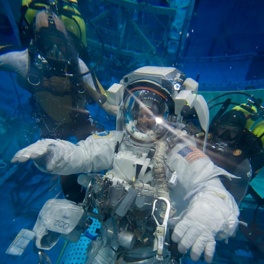 An astronaut conducts important experiments in the Neutral Buoyancy water tank.