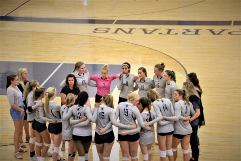 The team getting a pep talk from coach, Amber Hall, at the first home game of the season vs. Central. 