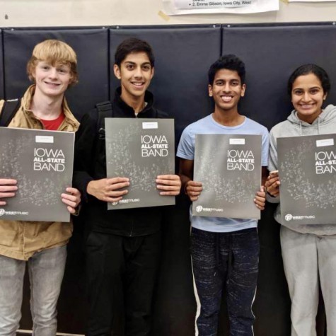 (From left to right) Sam Mcgrath, Ani Pradeep, Sanjiv Iyer, and Amulya Pillutla pictured with their All-State packets after being accepted into the All-State Band. 