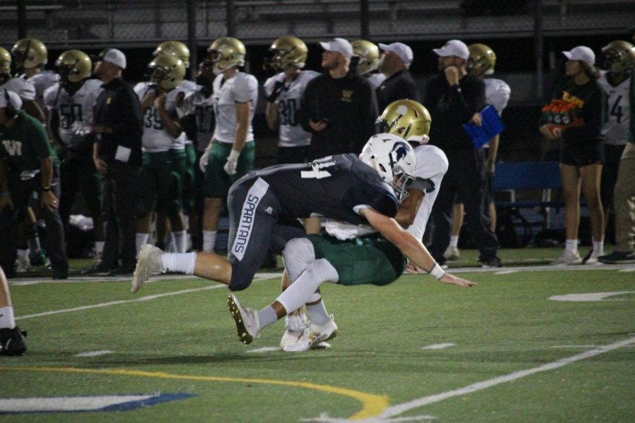 George Venzke hits Iowa City’s QB by leading with his shoulder instead of  spearing with his helmet.