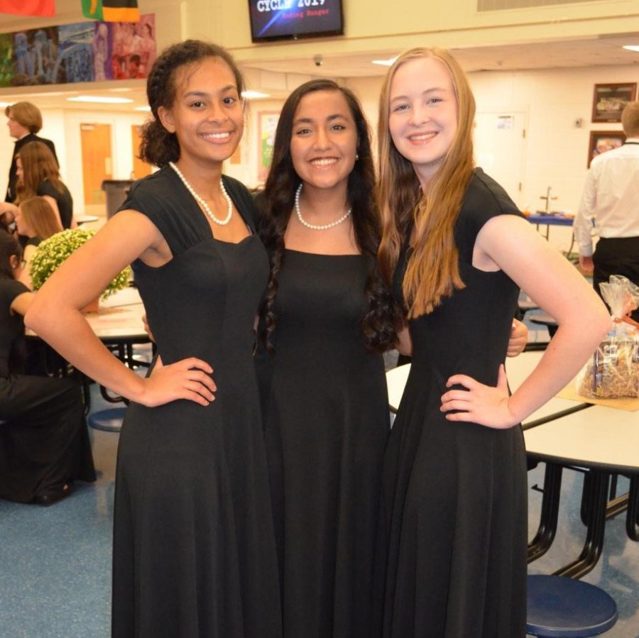 Chamber Choir members Ciyanna Wilson, Preksha Kedilaya and Holyn Doran pose at the reception that followed the fall choir concert. 
