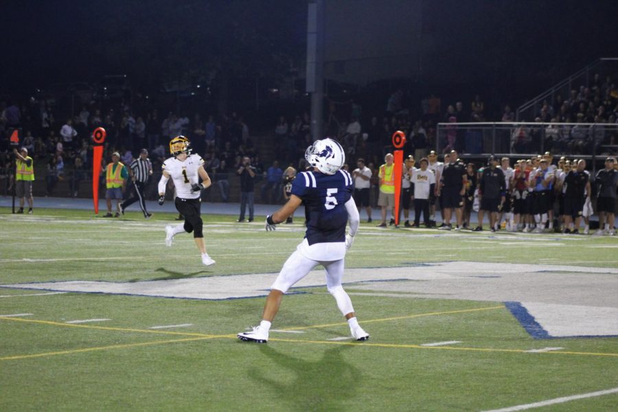 Senior Jose Lara fields a kick in Pleasant Valley’s game against Bettendorf in August.