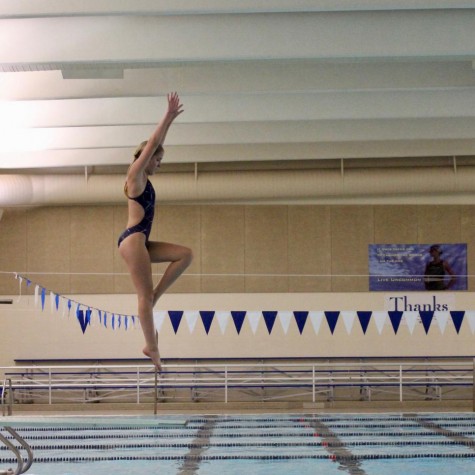 Emily Clark practices a dive by herself during a practice earlier this week.