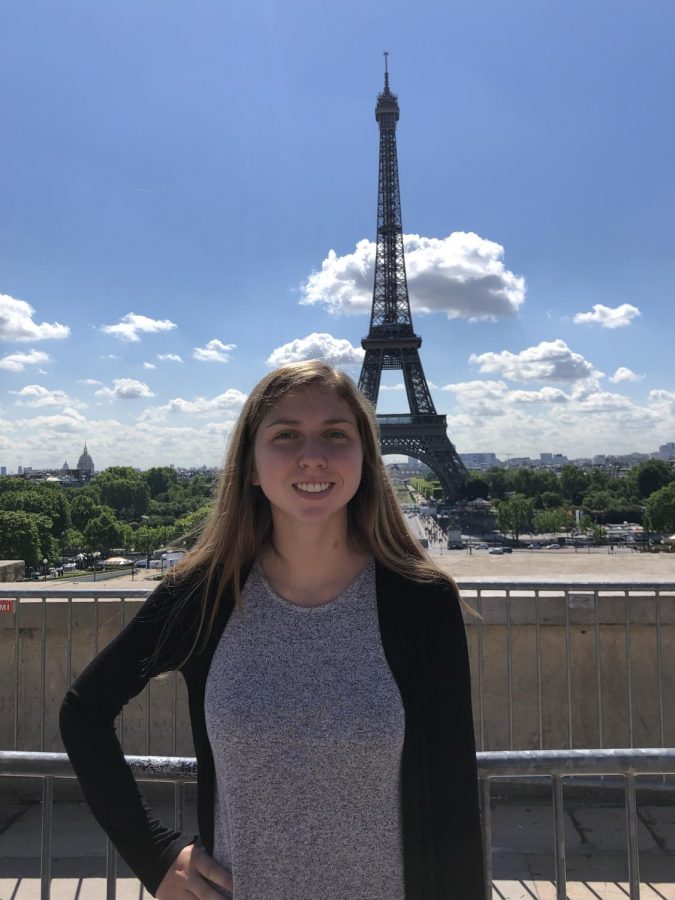 Senior Gena German stands in front of the Eiffel Tower on her recent summer trip to Europe. 