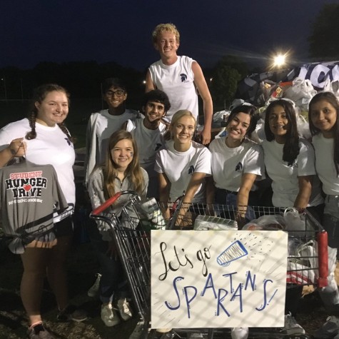 Members of Pleasant Valleys Spartan Assembly enthusiastically collect donations for the Student Hunger Drive during a home football game on Aug. 30.