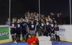The Spartans Dek Hockey team celebrate with their student section after their final regular season win.