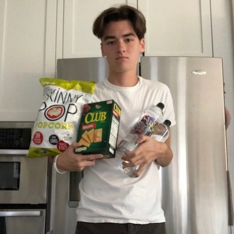 Senior Jack Meyers prepares himself for the apocalypse by stocking up on essentials, such as water and foods high in carbohydrates.