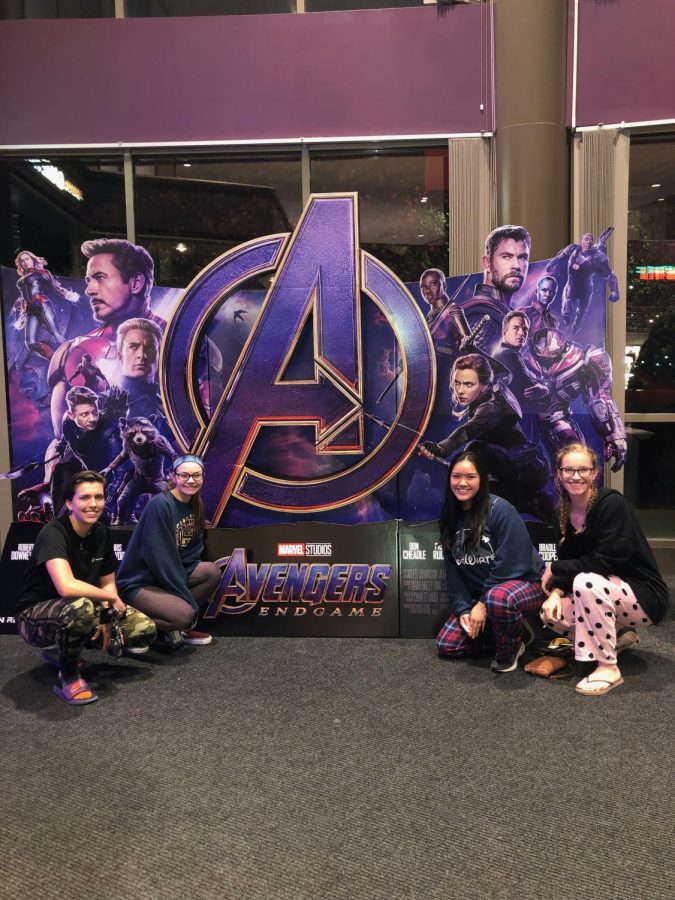 Female students Maria Vaaler (left), Ada Duncan (left-center), Nikki Chang (right-center) and Katie Bullock (right) pose in front of an Avengers: Endgame cutout prior to watching the movie.