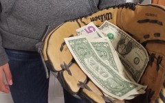 A student considers the money as a factor to playing college sports.