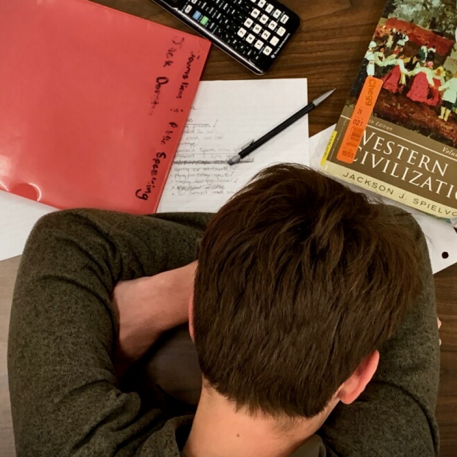 Senior Jack Donahue neglects his homework and puts his head down to rest.