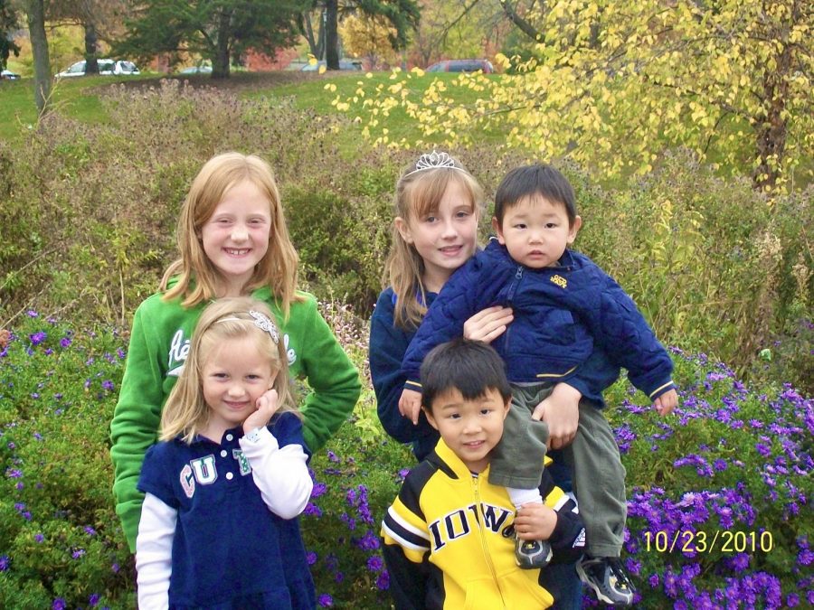 Siblings Delaney, Hayden, Kaitlyn, Brady and Griffynn Evans pictured together at a park in Des Moines, Iowa. 
