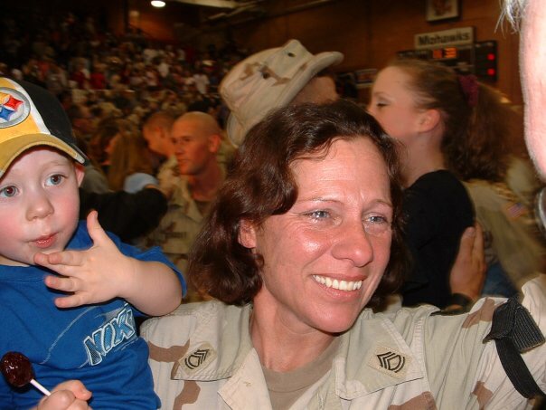 Kim Marovets holds her grandson: a young Caleb Hawbaker.
