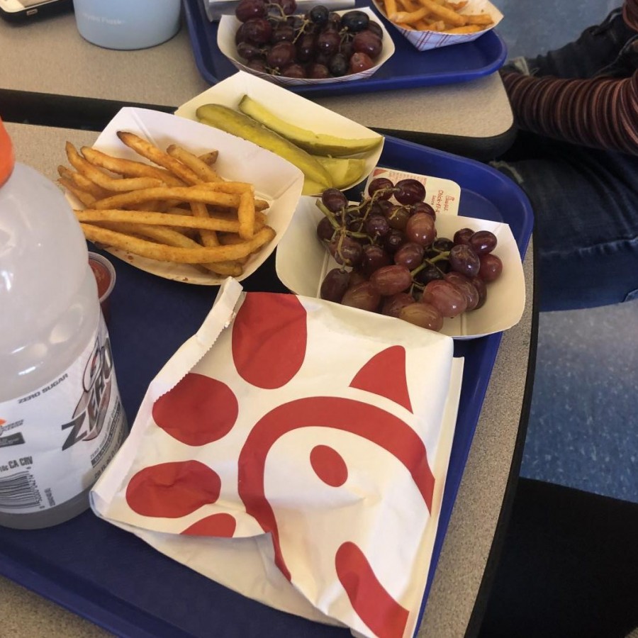 Students at lunch fill up with their trays on Thursday with chicken sandwiches from the popular fast food chain: Chick-fil-A.