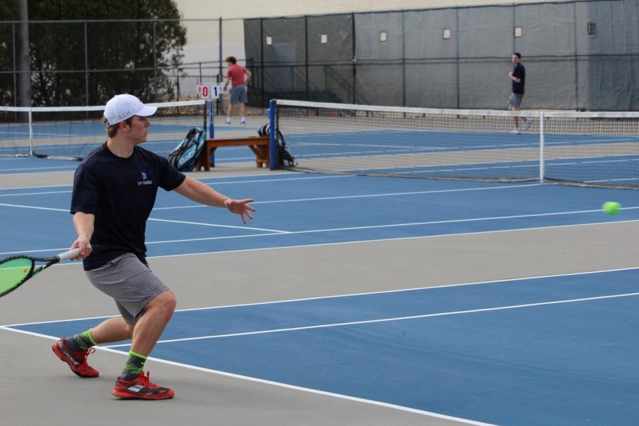 PV+graduate+Justin+Sehlin+plays+in+a+tennis+meet+at+Pleasant+Valley+High+School.