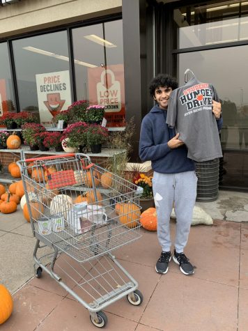 Junior Spartan Assembly member Sid Sharma takes a shift at the Bettendorf HyVee on Oct. 30 to collect donations for the Student Hunger Drive.