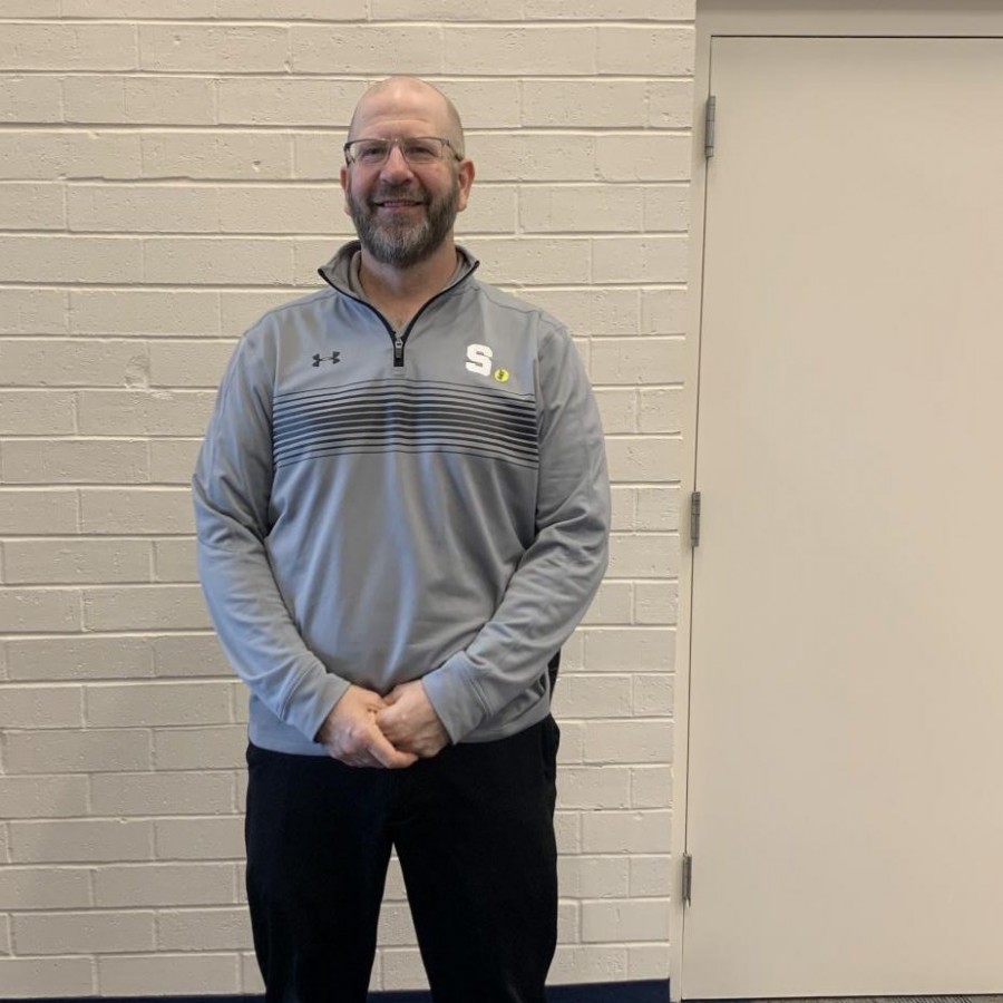 Principal Darren Erickson posing for a photo after his interview with reporters Maddy Licea and Nate Martell.