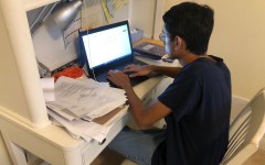 Aditya Desai focuses on completing his 13th college application before the November deadline.