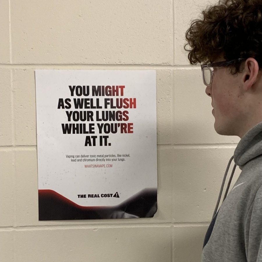 Junior Porter Groves encounters a vaping poster after going to the bathroom.