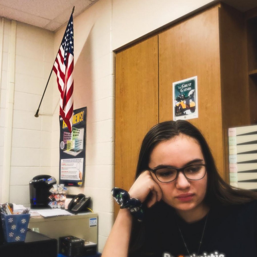 The American flags lies forgotten in the corner as senior Anna Myatt ignores its presence.