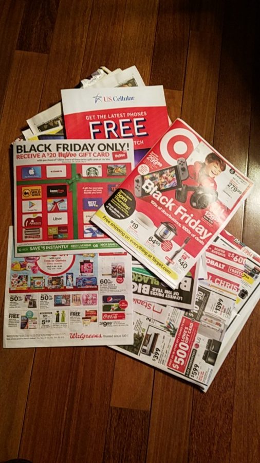 A+pile+of+Black+Friday+ads+collected+by+a+student+showcase+the+many+deals+that+stores+are+offering+for+the+holiday.