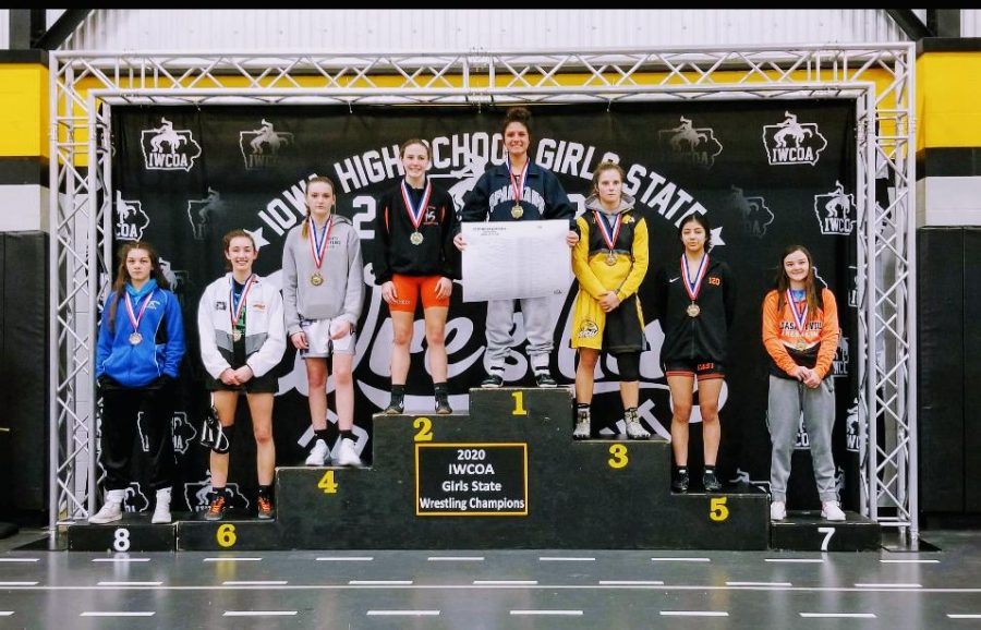 Senior+Chloe+Clemons+celebrates+her+120+pound+state+championship+on+top+of+the+podium+at+Waverly+Shell-Rock+High+School+on+Jan.+25%2C+2020.