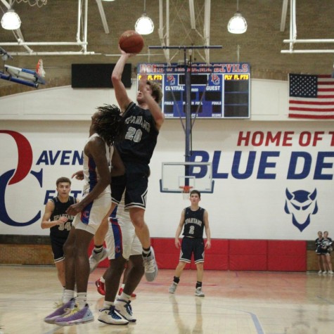 Junior Jacob Townsend jumps to hit the floater over a defender.
