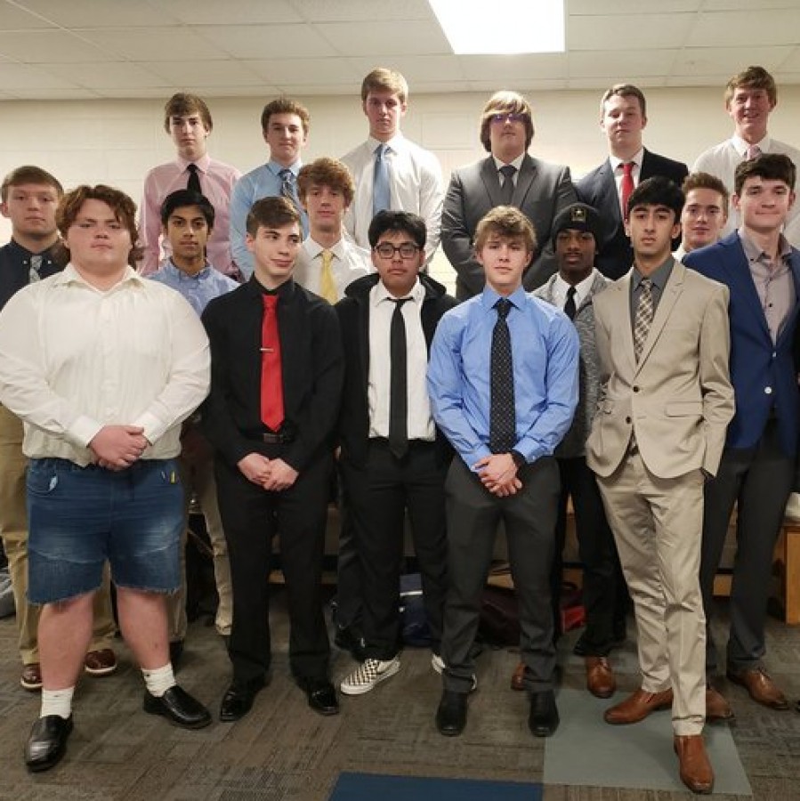 Suit Friday participants pose for a picture in between periods on Jan 24.
