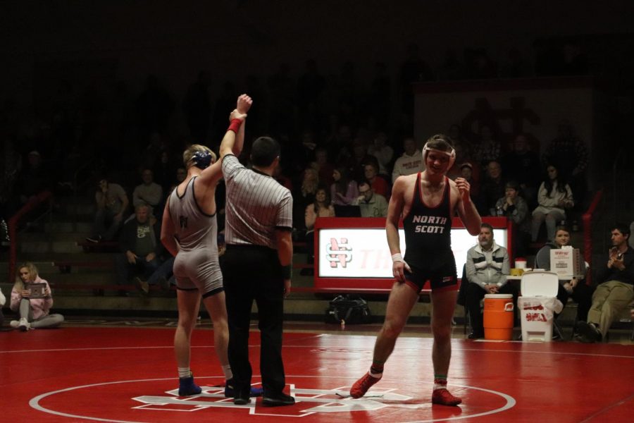 Eli Loyd gets his hand raised after beating North Scotts Nate Link at their dual meet in The Pit on Jan. 30, 2020.