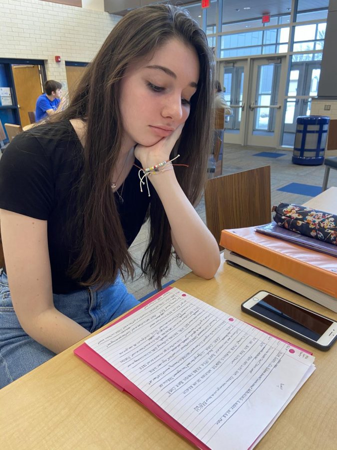 Junior Reese Thompson, fatigued from the inconsistent weather, struggles to have the energy to do her homework during study hall at PVHS.