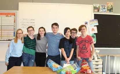 The PV art club poses with some of their work at a chips and salsa party last week.