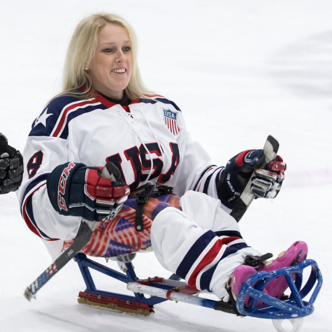 PVHS aide and captain of the USA women’s sled hockey team, Erica Mitchell warms up for her game against Canada.