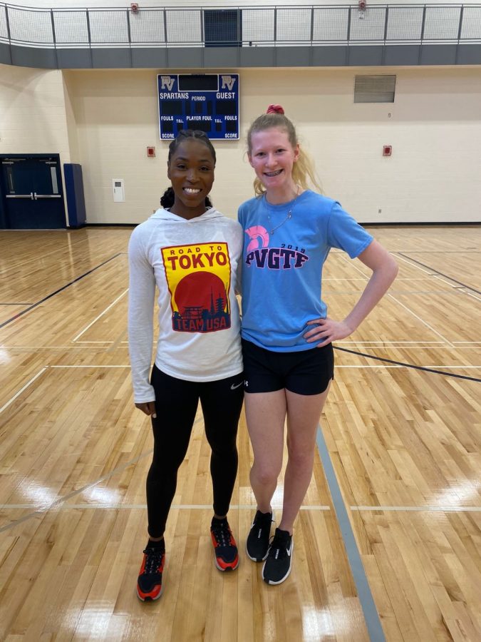 Junior Harmony Creasy poses for a picture with Tianna Bartoletta after the 'Why You're Not a Track Star' workshop at PVHS