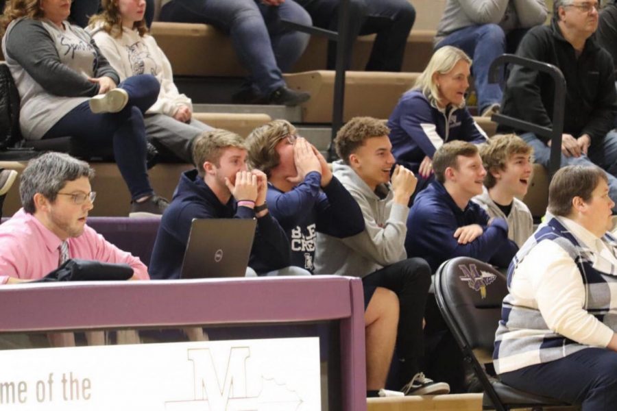 Super fans come to watch the girls basketball team play Muscatine at Muscatine on Feb. 19.