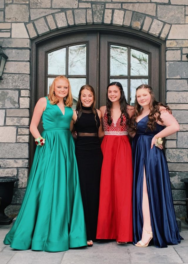 Seniors+%28left+to+right%29+Lena+Ahrens%2C+Clare+Basala%2C+Morgan+Ramirez+and+Caroline+Young+pose+for+a+picture+before+they+attend+their+quarantine+prom.+