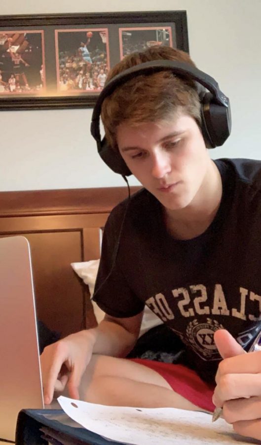 Senior Carter Cline is productively completing online schoolwork.