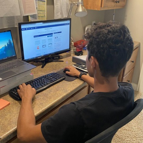 Junior Vinay Joshi attempts to navigate the new ACT registration process. 