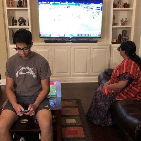 
Avid NFL fans Akash Pradeep and Bhanu Ravindran watch the Packers vs Saints game on Sunday September 27, 2020. Ravindran watches the game in support of the league’s use of their social platform for protest while Pradeep looks away in disapproval. 

