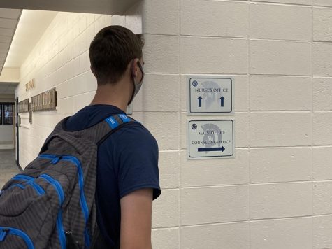 Student Looking at a Sign