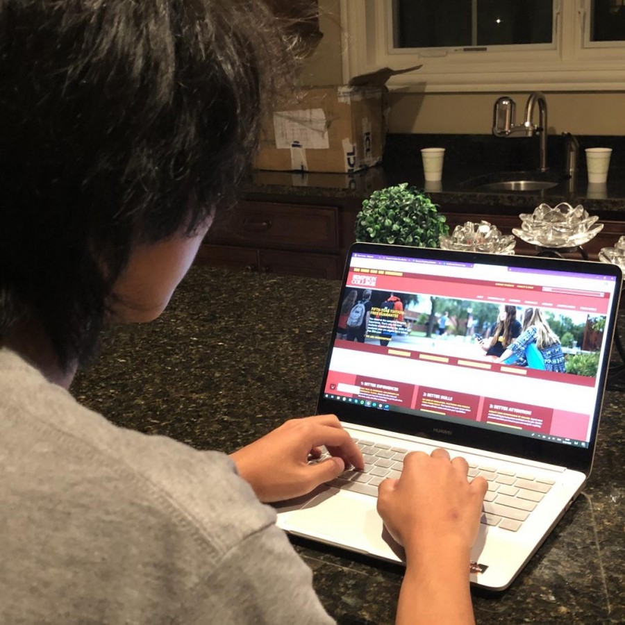 Senior Sandro Xiao researches the website of Simpson College on Sept. 20, searching for answers to his questions about admission for the 2021-2022 school year.