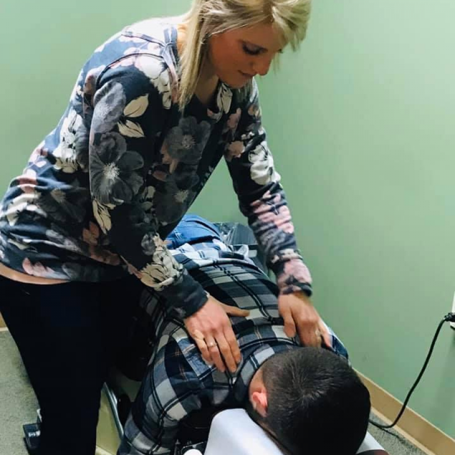 Dr. Lindsay Gall, a chiropractor, adjusts a patient at Nelson Chiropractic in Bettendorf. 