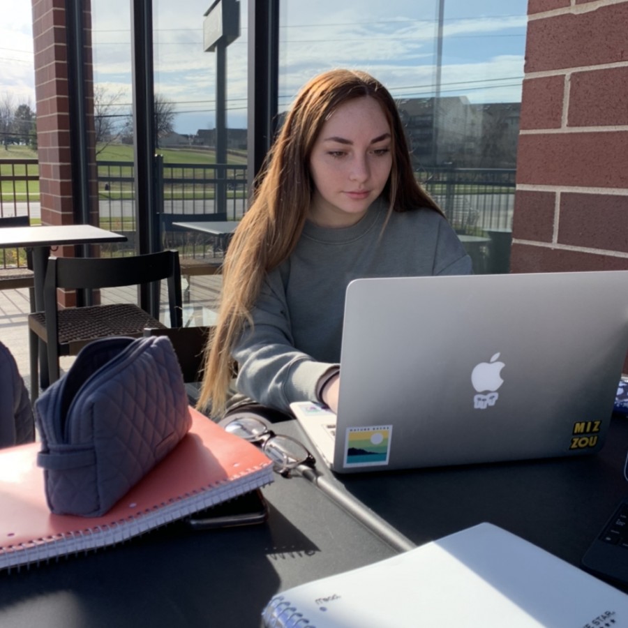 Senior Emma Cramer doing her online school work at Starbucks.