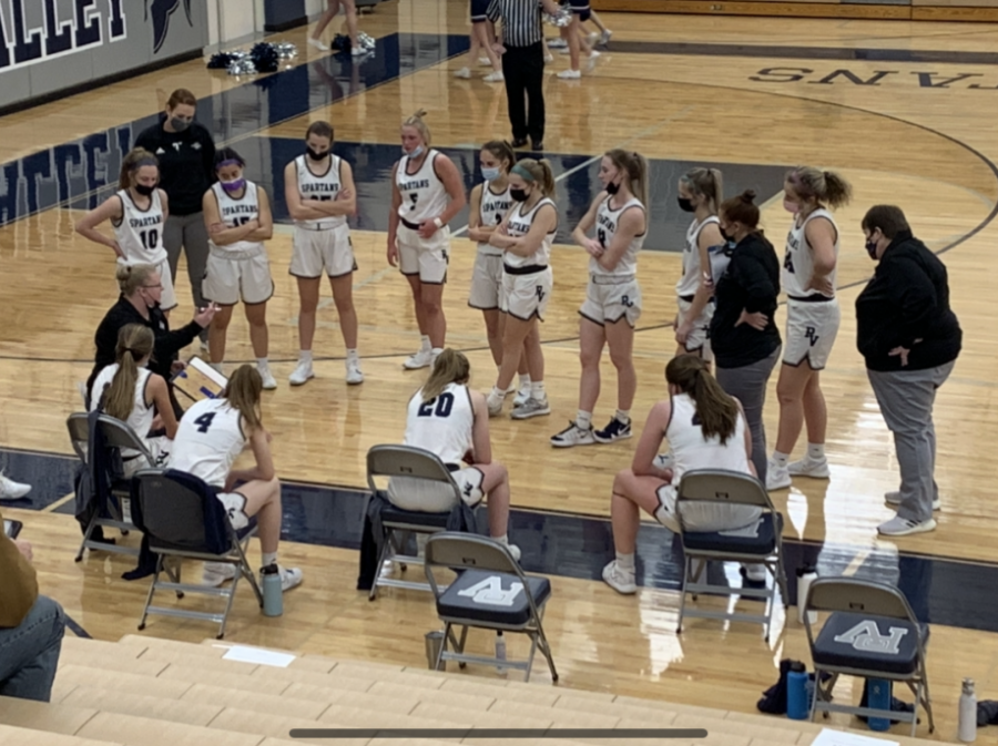 Pleasant Valley Girls Basketball team in huddle during their game against Davenport North on Feb. 5.