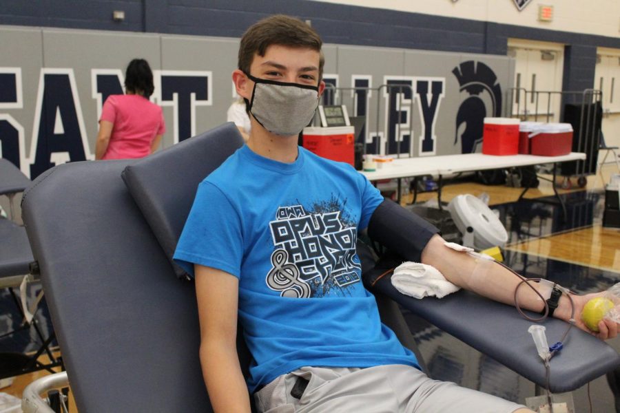 Bryce Vining donates blood.
