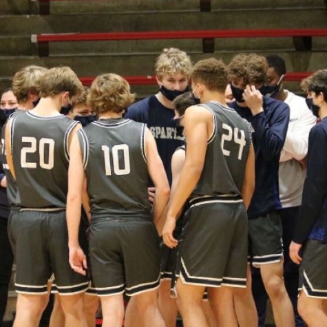 Pleasant Valley’s boys basketball team huddles to motivate and hype themselves up before returning to the court to face off against North Scott on Dec. 8, 2020.