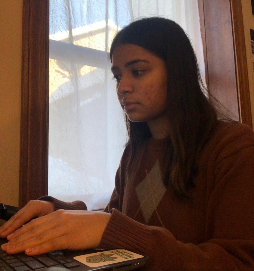 Muskan Basnet working on homework while 100 percent online, weeks before switching to 100 percent in person learning. 