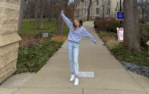 Alyce Brown stands with open arms, embracing her acceptance into Northwestern University, as she looks to a prosperous future in journalism beyond Iowa.