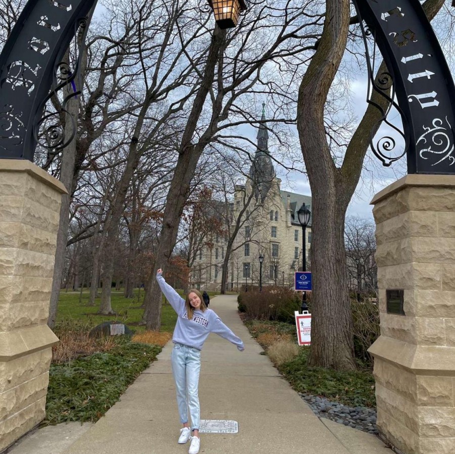 Alyce Brown stands with open arms, embracing her acceptance into Northwestern University, as she looks to a prosperous future in journalism beyond Iowa.